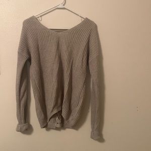 Cute cream sweater with laces down the back! Size: S